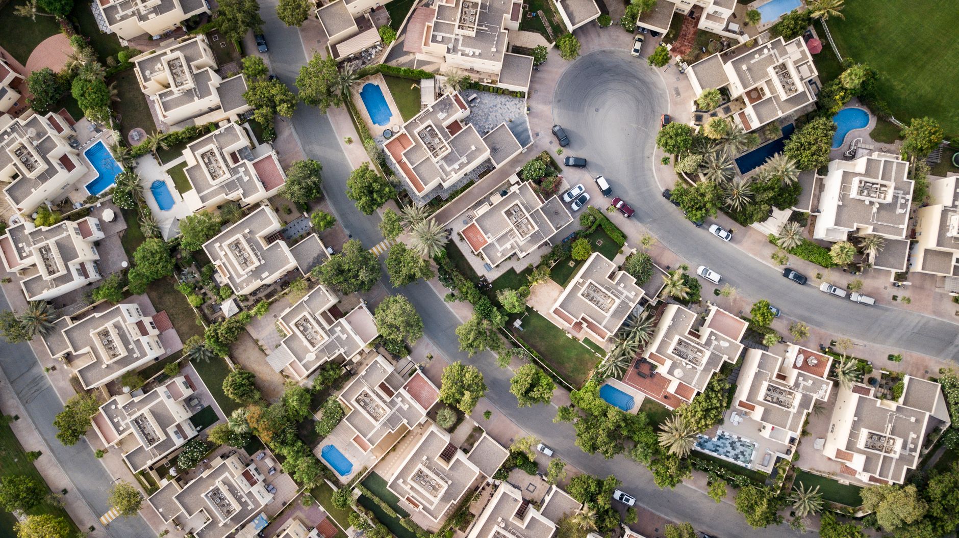 Aerial view of a residential villa and garden development